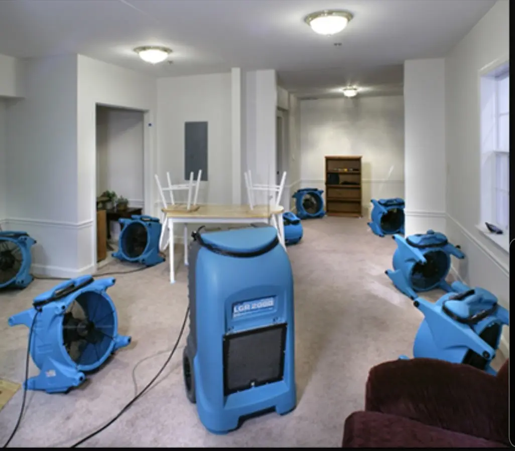 Air movers and dehumidifier setup for Water Damage Restoration in Rock Island